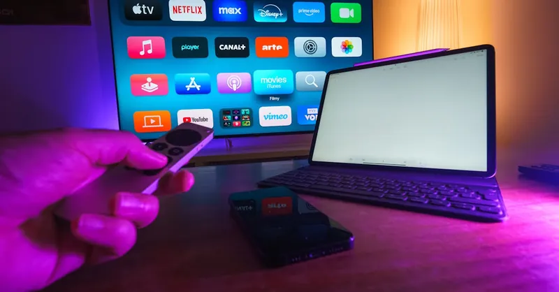 A cozy home setup featuring streaming services on smart TV, tablet, and smartphone.